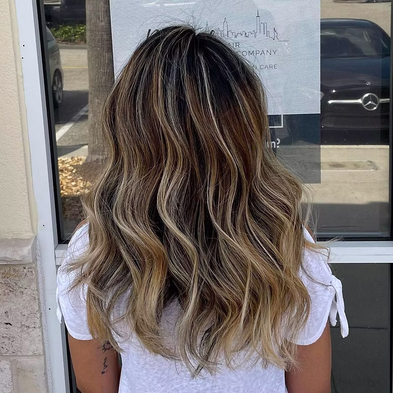 Soft brunette balayage with loose waves Soft brunette balayage with loose waves